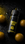 Kuro Umeshu Plum vape bottle beside fresh plums on a dark wet surface with moody neon lighting and premium Japanese-inspired aesthetic.